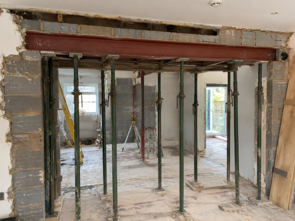 Temporary propping supporting a load-bearing wall during structural alteration